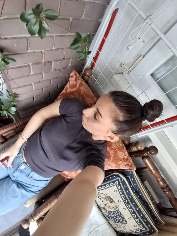 Woman captures casual moments in Sofia apartment balcony