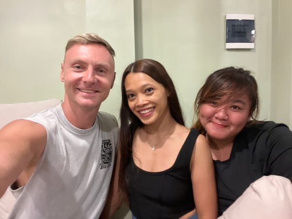 Three people pose for photo in North Kuta