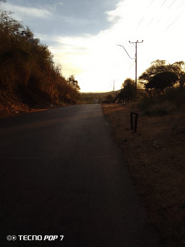 Road scene captured in Altagracia, Venezuela under evening sky