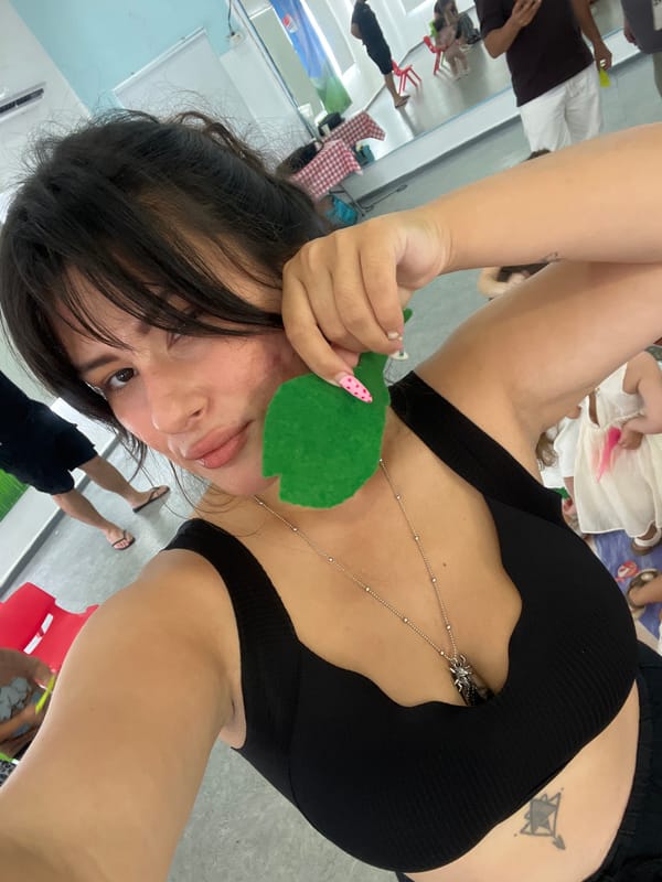 Close-up selfie, blurry and low-angle, location unknown.