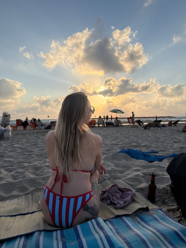 Sunset and paddleball on Tel Aviv's busy Mediterranean shore