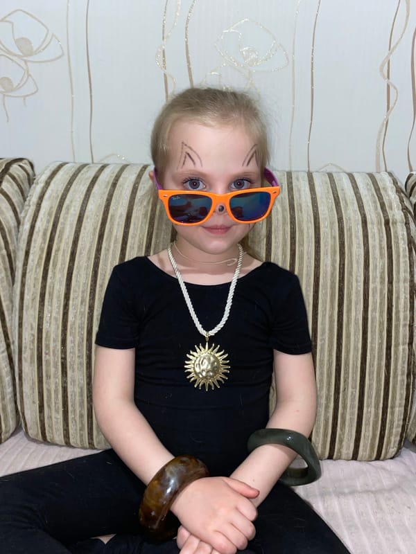 Child and puppy share playful moments in Votkinsk home