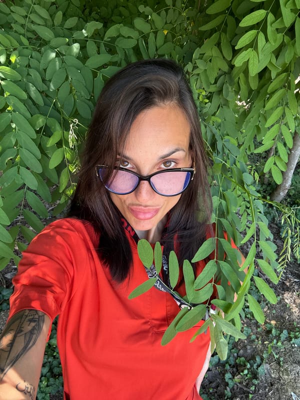Outdoor selfies near a Pleven medical facility, mid-morning break
