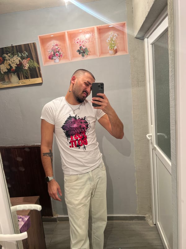 Man takes multiple selfies indoors in Shumata, Bulgaria