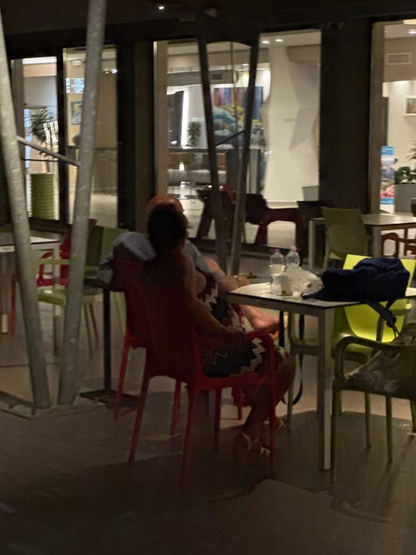 Inside a stylish bar-lobby in Isola delle Femmine at night