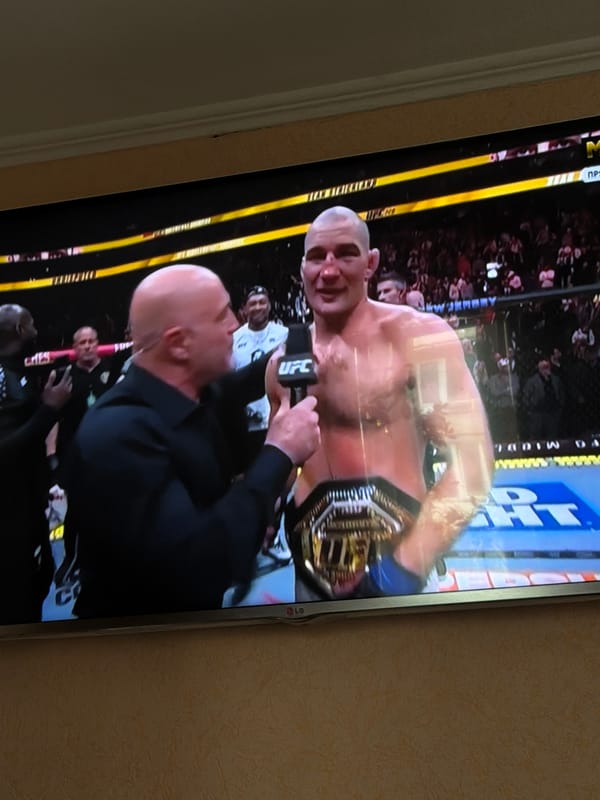 Resident watches UFC Chimaev-Strickland fight on television in Russia