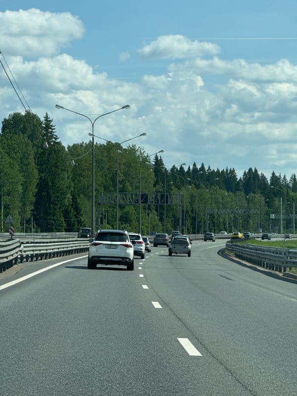 Highway traffic observed near Vartemyagi, Russia under clear skies