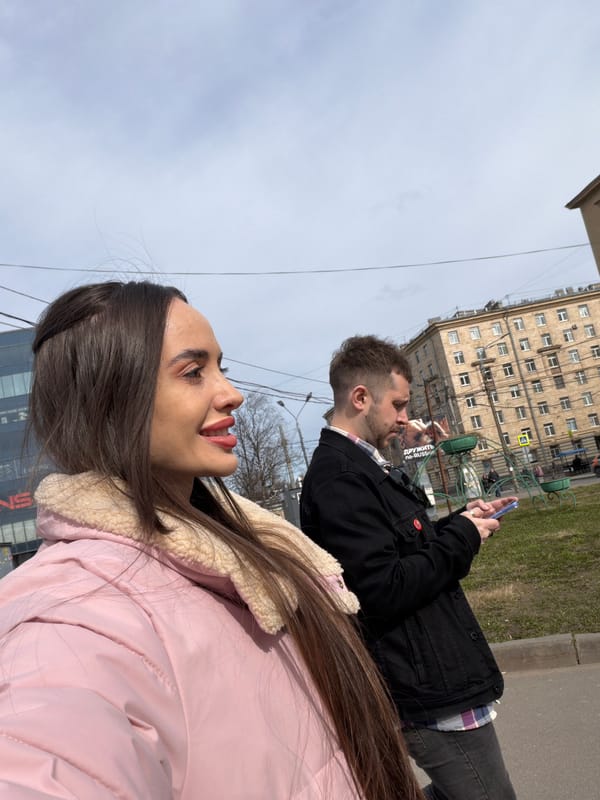 Crowd gathers at yellow wooden church in Saint Petersburg