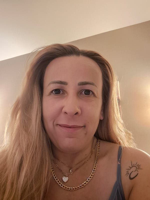 Bedroom selfie series with celestial top and gold jewelry