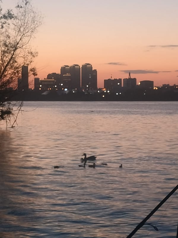 Novosibirsk skyline glows along the river at golden hour