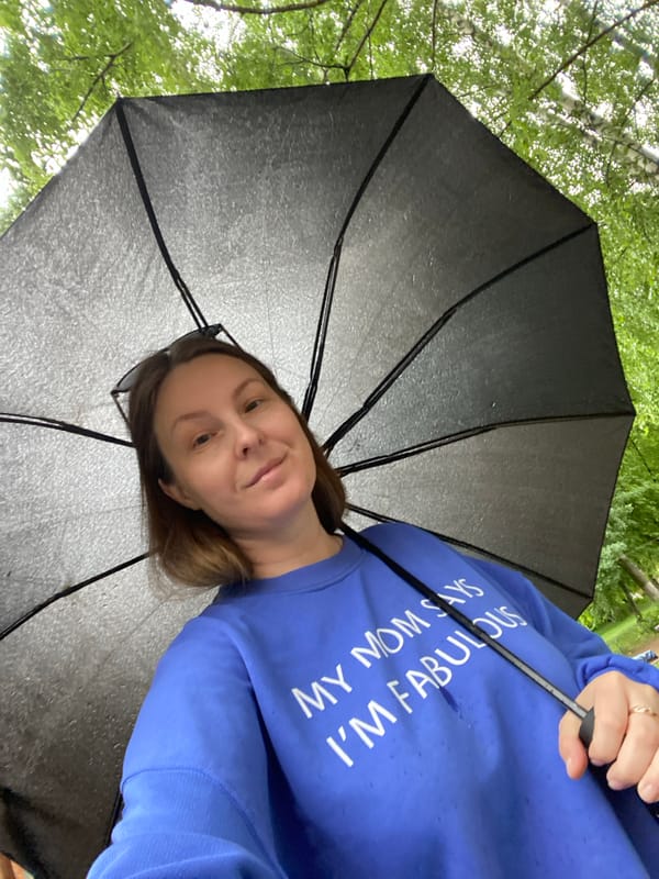 Early morning rain brings umbrellas and puddles to Noviy