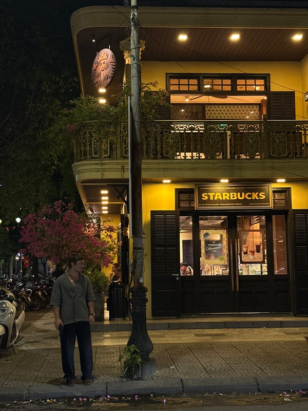 Starbucks fits into Hoi An's traditional streetscape at night