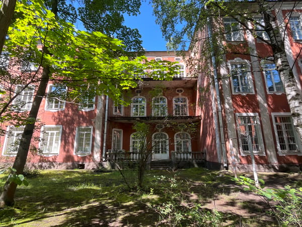 Historic red mansions and park grounds, Saint Petersburg summer morning