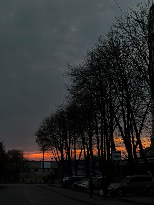 Orange sunset breaks through overcast sky in Vinnytsia