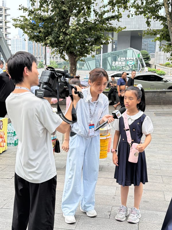 News crew and street vendors near a Chongqing subway entrance