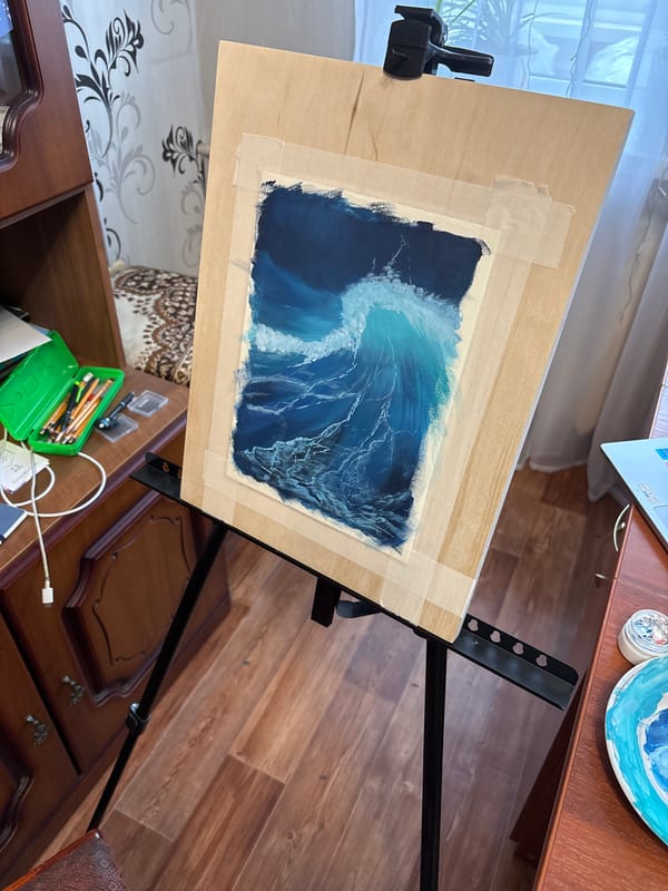 Artist paints ocean wave scene on easel in Izhevsk