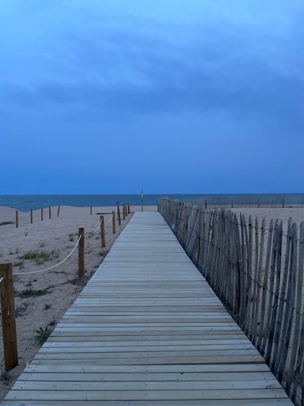 New wooden boardwalk observed extending to coastline in Calella