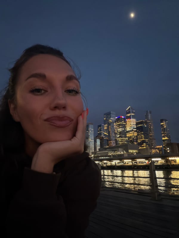 Woman selfie, city nightscape captured in NYC early morning