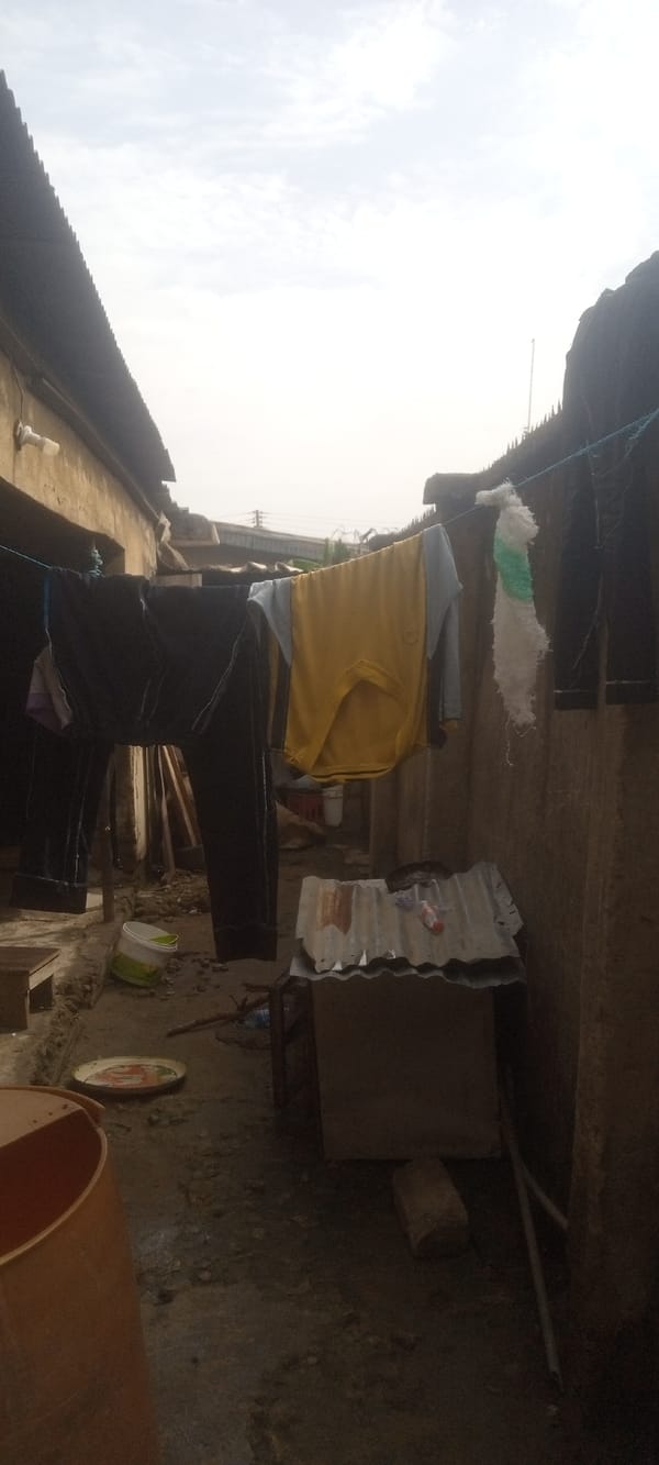 Residents handle water storage systems in Nigerian neighborhood