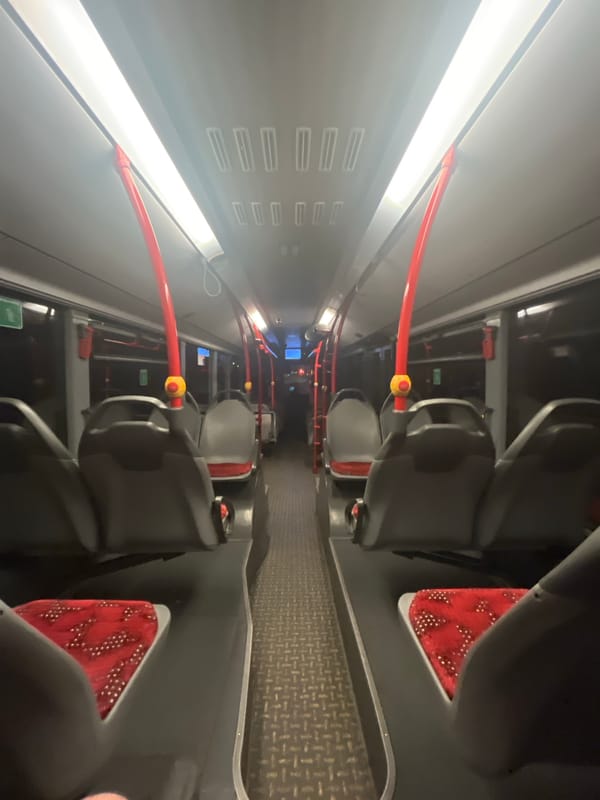 Man with mobile phone rides public bus in Gelsenkirchen