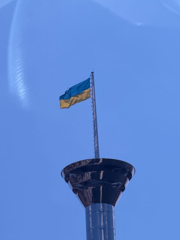 Ukrainian flag flies over Mykolaiv under clear skies