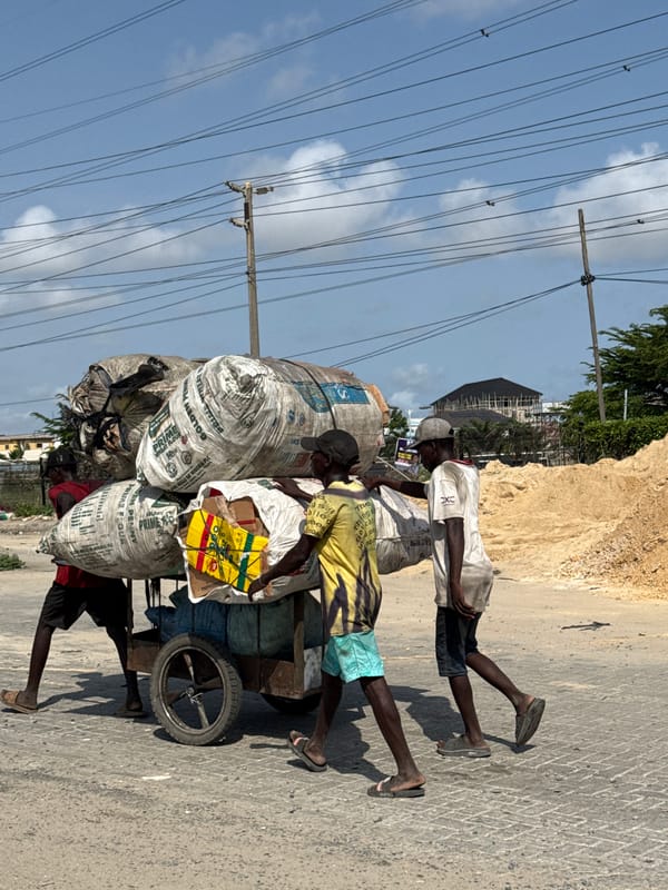 Men transport flour sacks by cart in Lekki