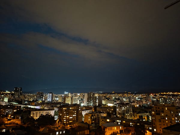 Tbilisi at night, sprawling city lights from above