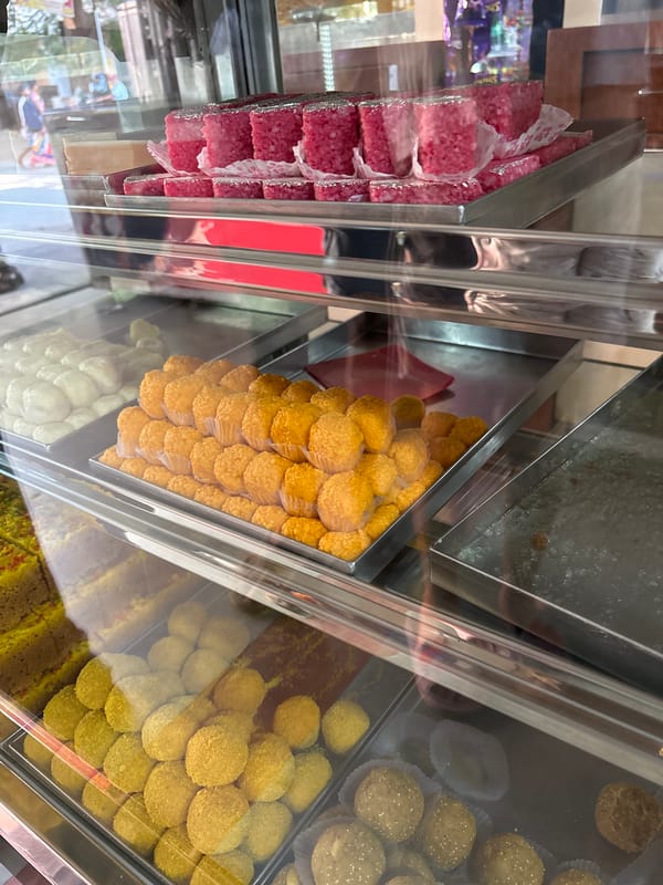 Indian sweets displayed in glass case in Ambernath