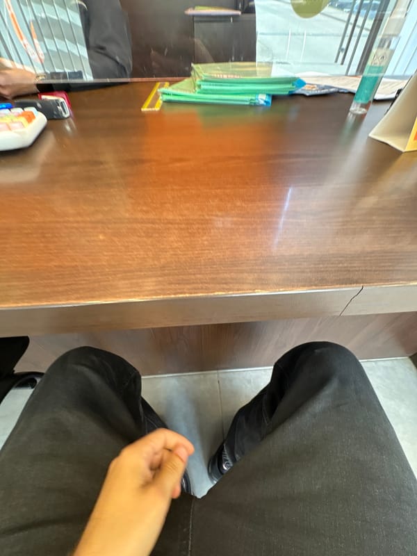 Person at cluttered wooden desk in Pleven, Bulgaria