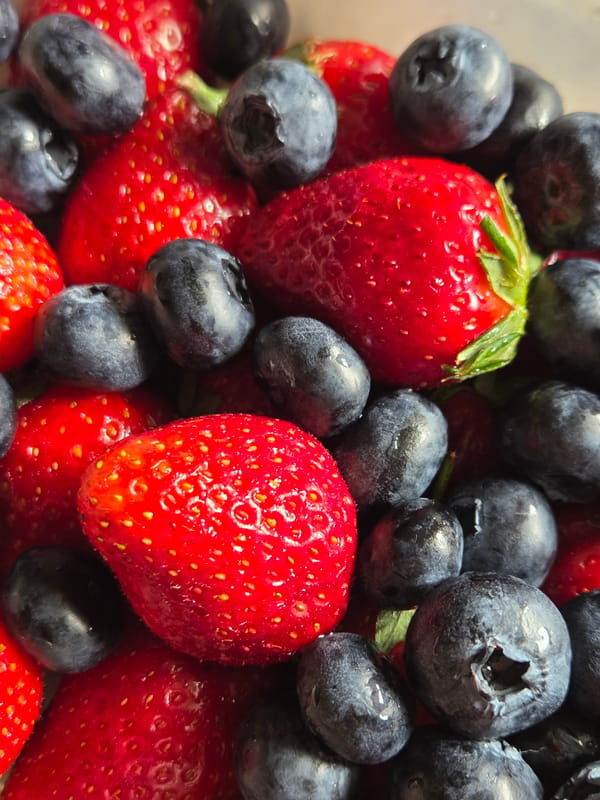 Close-up of fresh strawberries and blueberries photographed