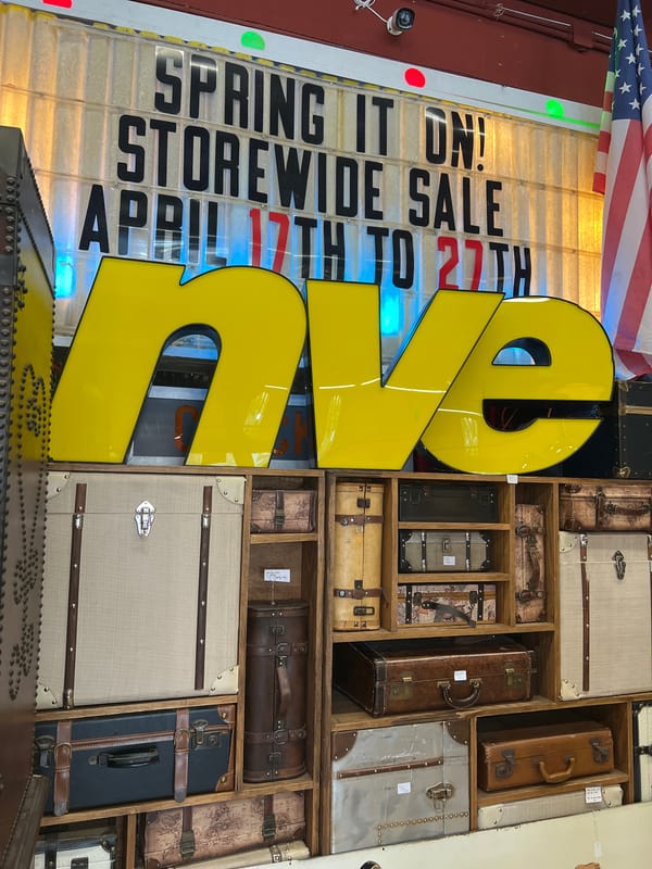 Visitor documents vintage collectibles shop interior in Newburgh, NY