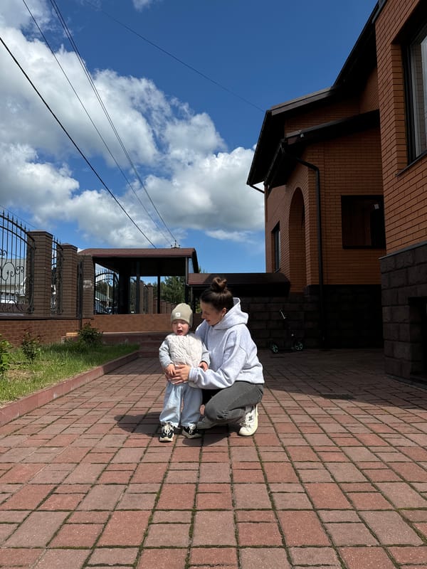 Family enjoys outdoor playtime in Vysokinichi backyard