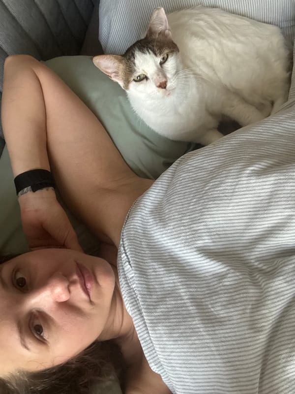 Woman and cat share quiet bedtime moment in Dubai