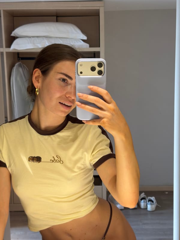 Woman takes mirror selfie in residential setting, Shunyi District