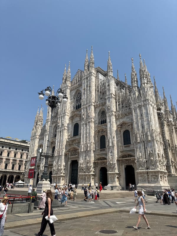 Milan's Duomo district on a busy summer morning