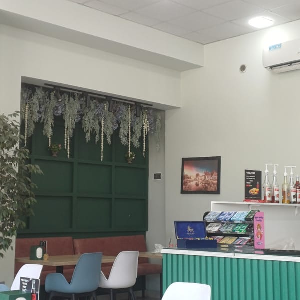 Interior of bright cafe or shop documented in urban location