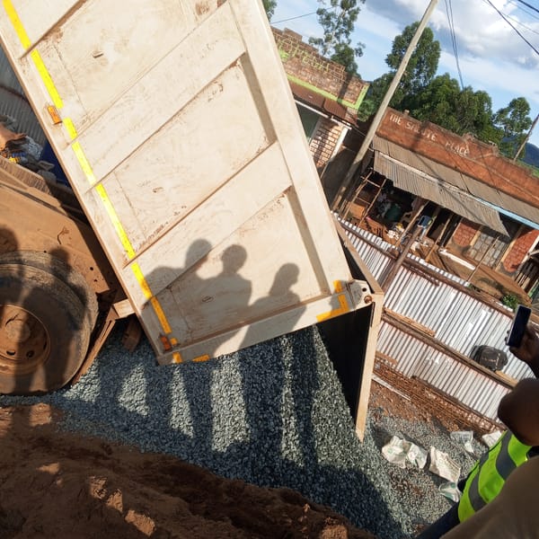 Construction workers excavate foundation at Kenya building site