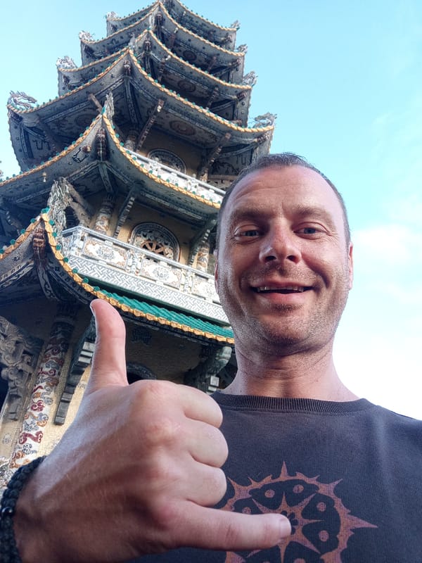 Temple visit with ornate pagoda and dragon mosaics in Vietnam