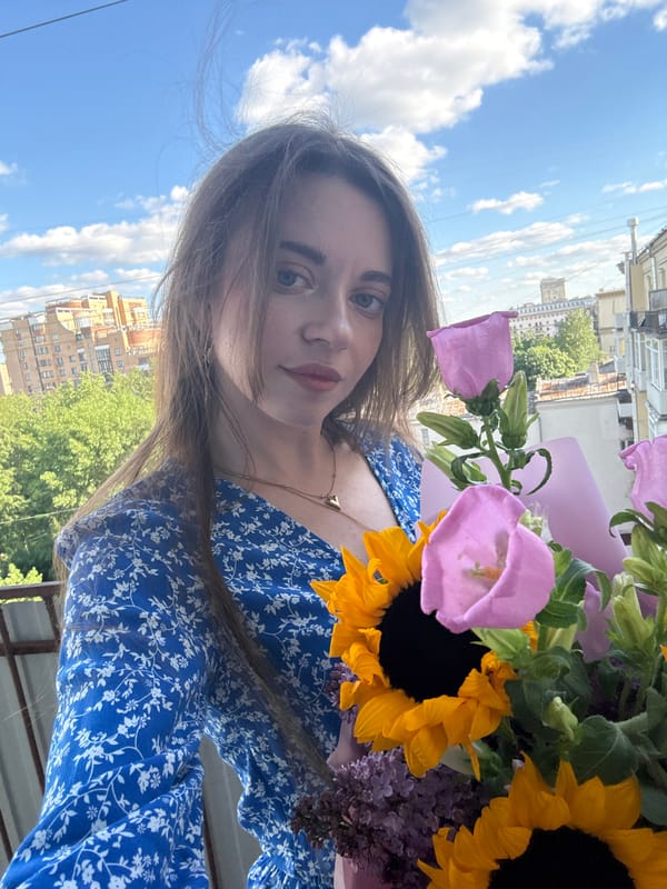 Woman takes flower bouquet selfie in Moscow