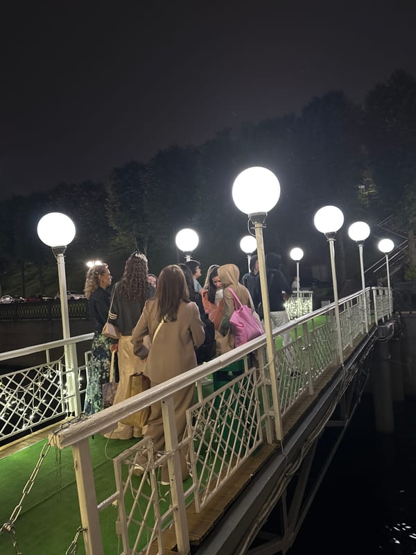 Evening gathering on a pier and boat, coastal Russia
