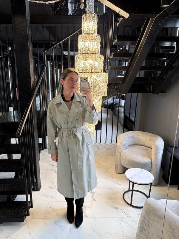 Woman takes selfie in elegant Moscow interior setting