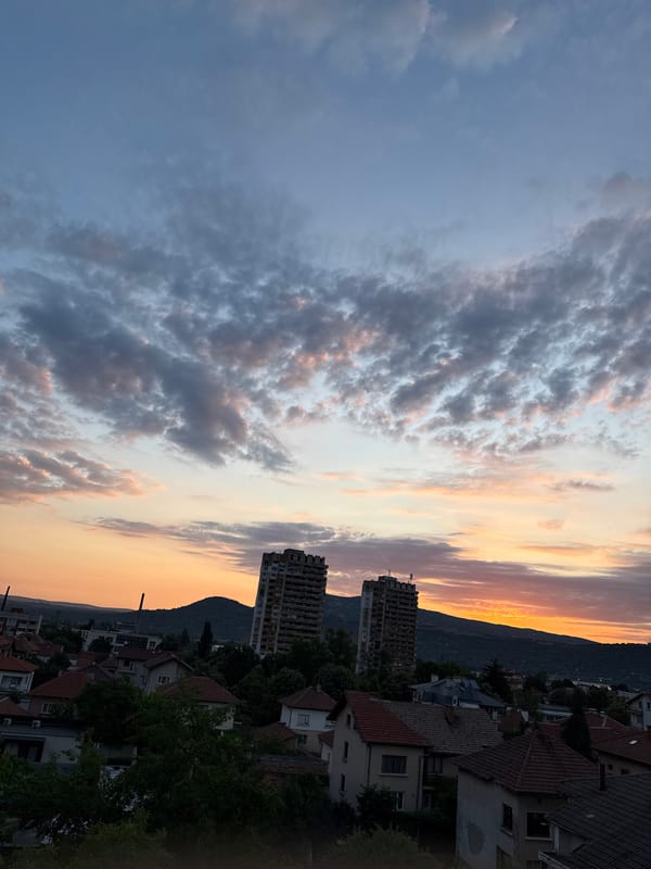 Sunset over Vratsa, with a cat on the windowsill