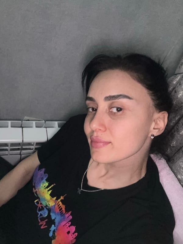 Person observed in casual moments inside Tbilisi apartment