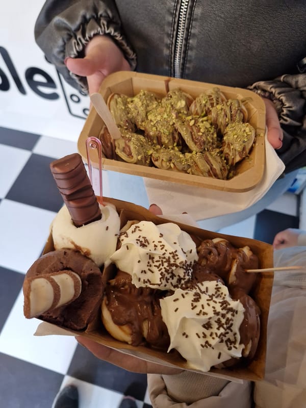 People enjoy desserts from boxes in Sofia, Bulgaria
