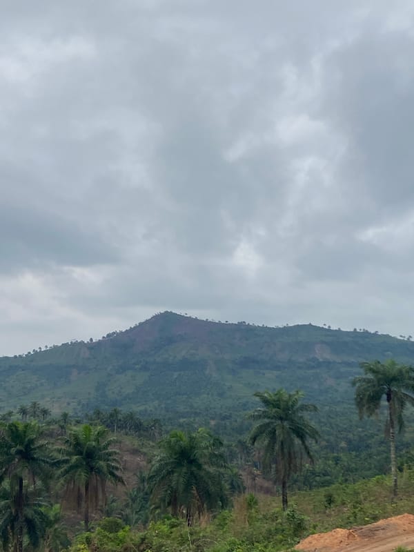 Cloud-covered mountain with lush vegetation observed in Achara, Nigeria