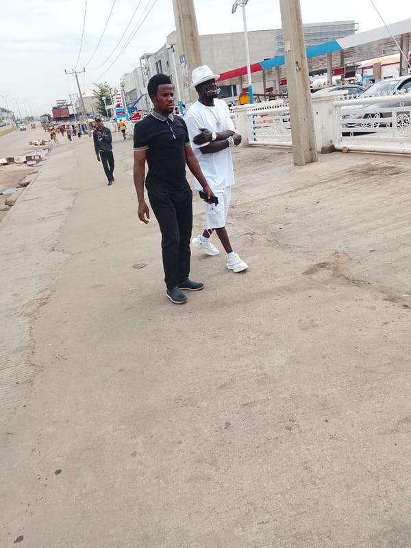 Morning street activity captured across Abuja business district