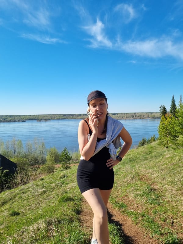 Woman hikes waterside trails in Ольховка, Russia