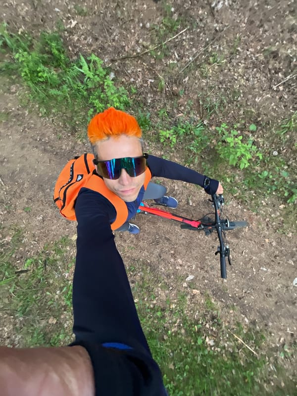 Orange-haired cyclist photographed during woodland outing in Chaikovsky, Russia