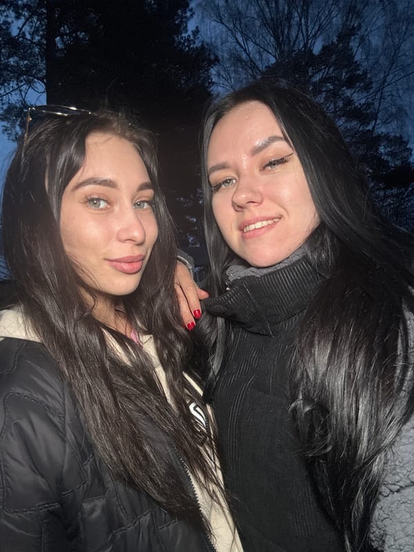 Women take evening selfies in Chaikovsky, Russia