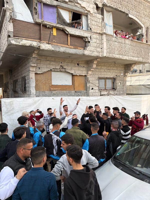 Thirty men gather around vehicle in Gaza City